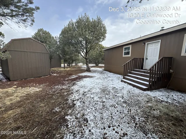 a house view with a backyard space
