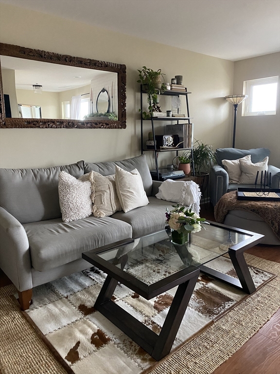 200 Falls Boulevard, Unit F304 Quincy, MA 02169 - Photo 1 of 21 a living room with furniture and rug