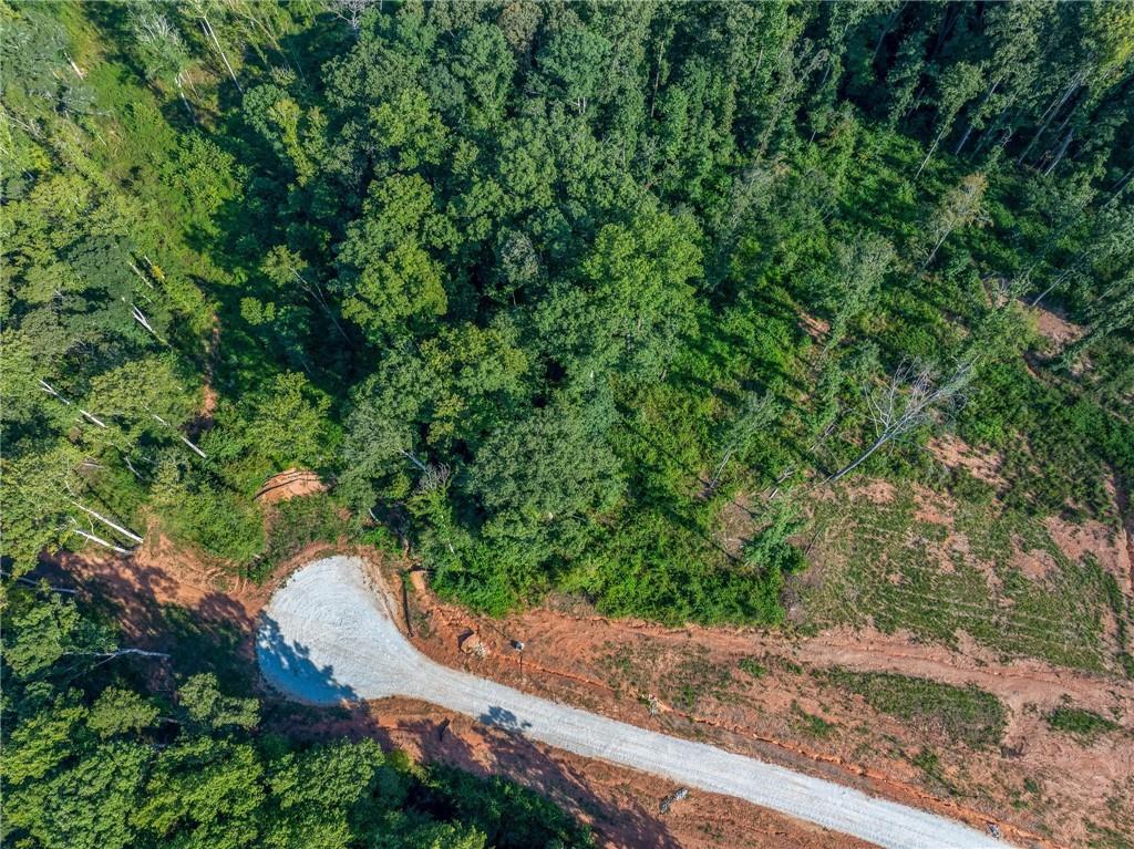 Lot 10 Stewart Loop Commerce, GA 30529 - Photo 6 of 12 an aerial view of residential house with outdoor space and trees all around