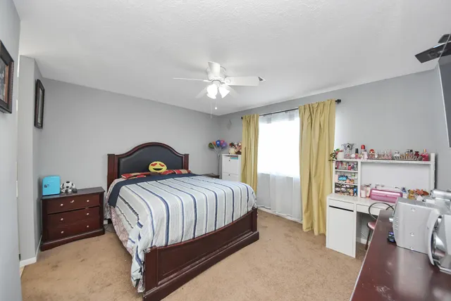 a bedroom with a bed and a cabinets