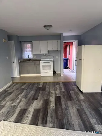 a view of kitchen with wooden floor