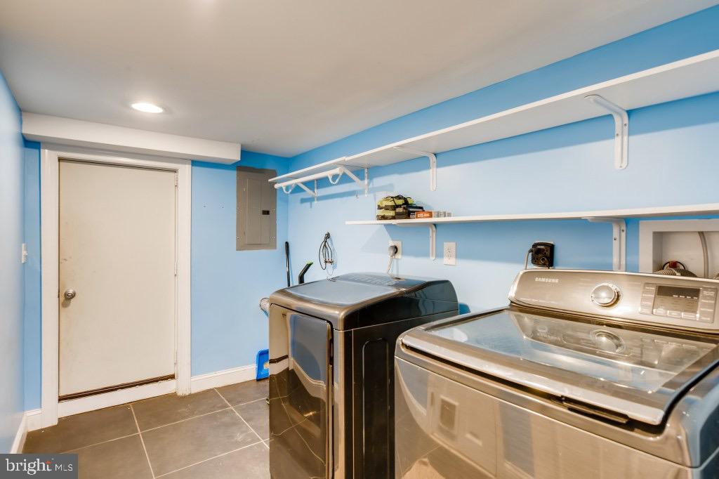 8126 Dalesford Road Baltimore, MD 21234 - Photo 22 of 26 Large laundry room with storage shelving/hangers