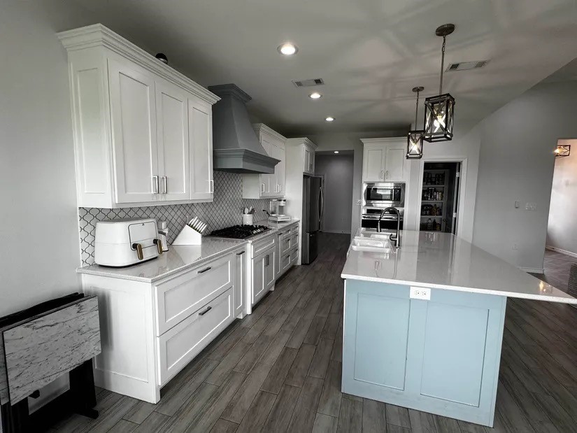2295 Diamond D Lane Beaumont, TX 77713 - Photo 7 of 40 a kitchen with stainless steel appliances granite countertop a sink a stove and cabinets