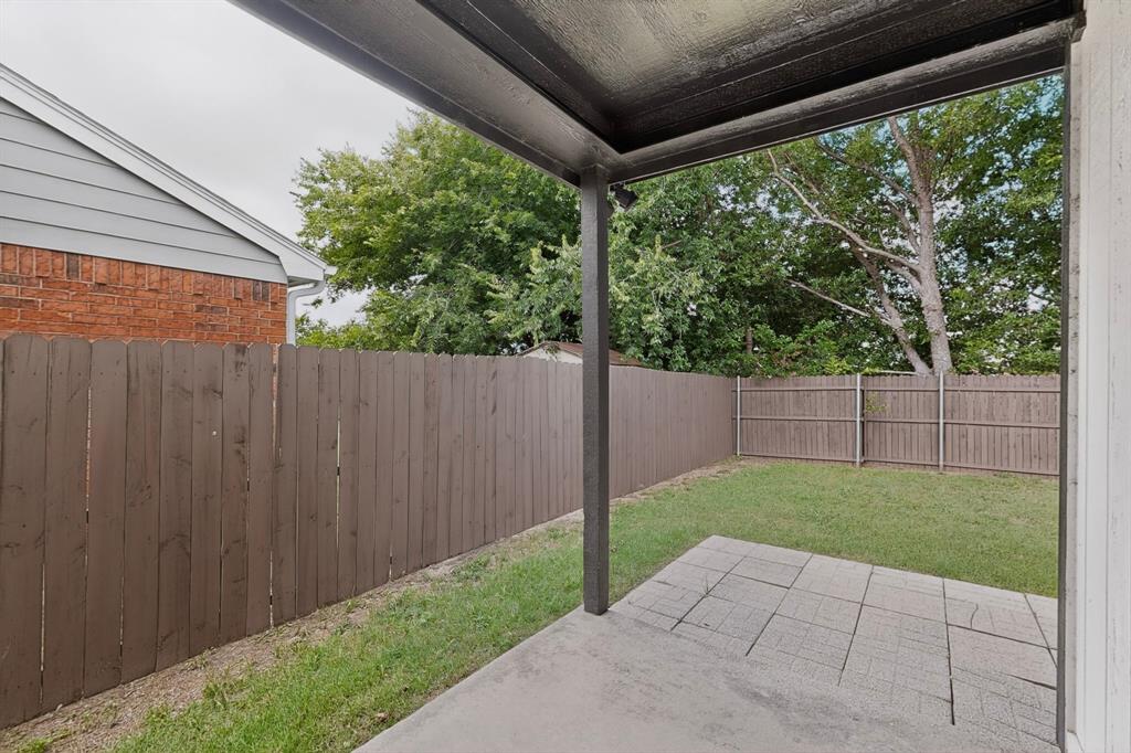 7729 Misty Ridge Drive North Fort Worth, TX 76137 - Photo 27 of 30 a view of backyard with green space