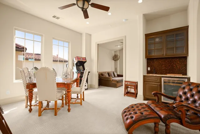 a bedroom with furniture and a large window