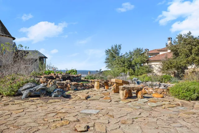 a view of a parking space with lots of trees