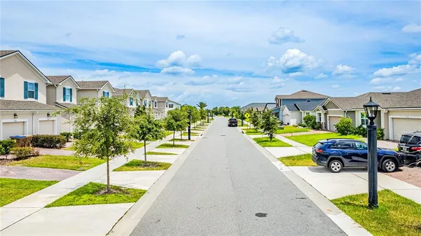 a view of a swimming pool with a lawn chairs