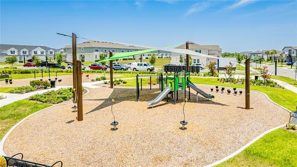 a swimming pool with outdoor seating and yard