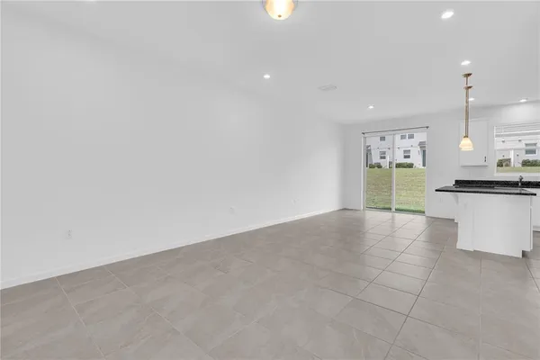 a view of a kitchen with a sink and cabinets