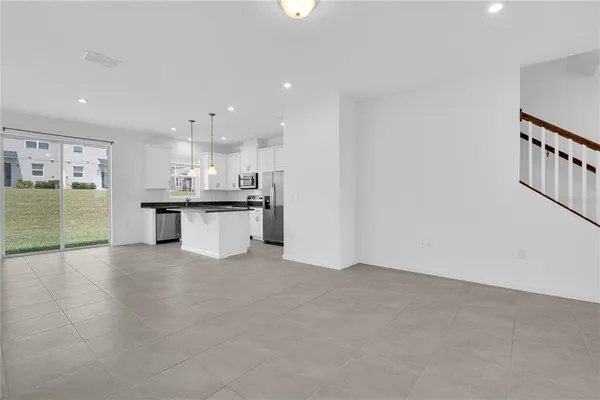 a view of a house with a big yard