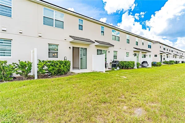 a view of a kitchen with a sink and a large window