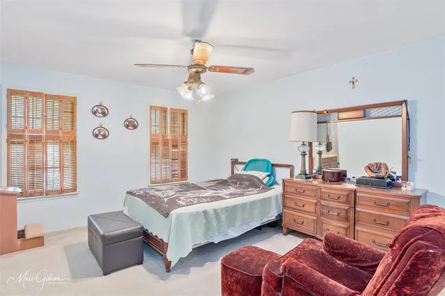 a bedroom with two beds and a couch