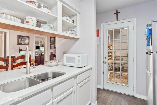a kitchen with stainless steel appliances granite countertop a sink and dishwasher
