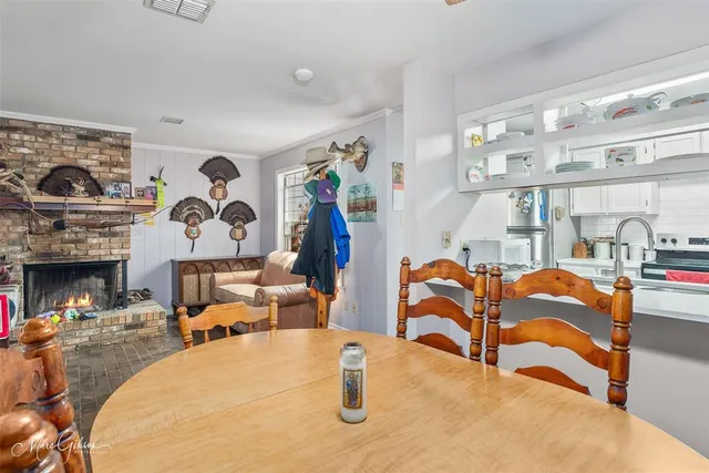 a bedroom with furniture and a fireplace