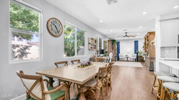 a view of a dining area with furniture window and wooden floor