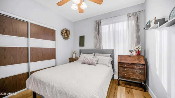 a bedroom with a bed and a dresser