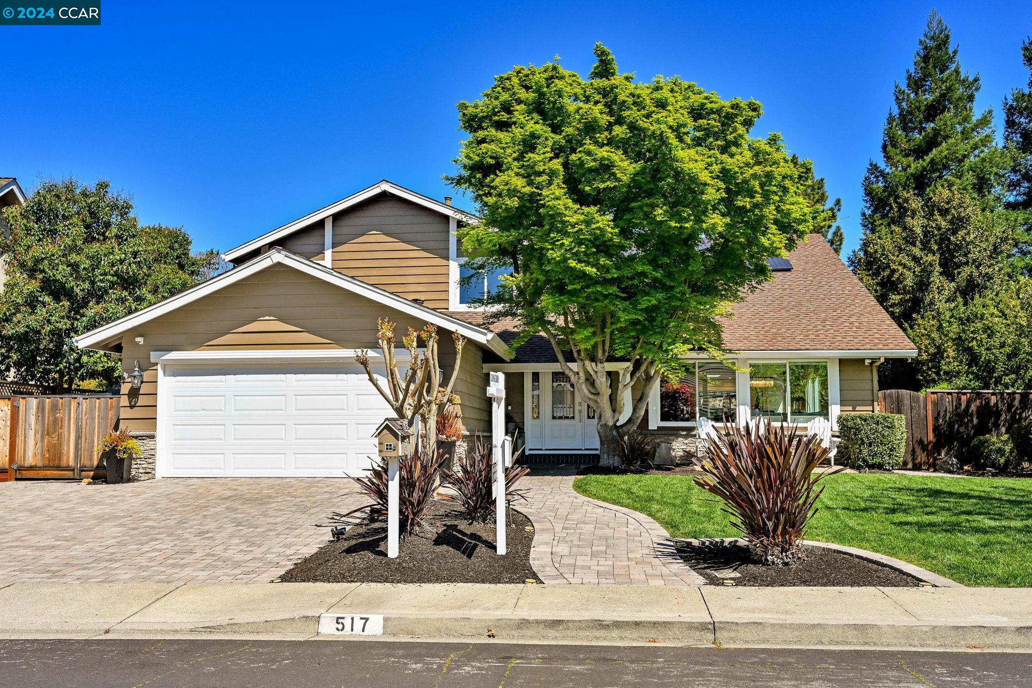 517 Zephyr Circle Danville, CA 94526 - Photo 1 of 1 a front view of a house with a garden