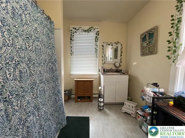 a room with a chair and gym equipment