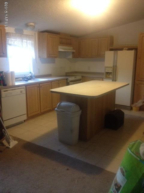 15470 Summitview Road Cowiche, WA 98923 - Photo 3 of 4 a kitchen with a sink and a refrigerator