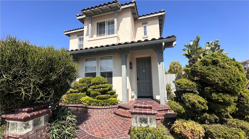 72 Peppermint Tree Irvine, CA 92618 - Photo 1 of 9 a front view of a house with a yard