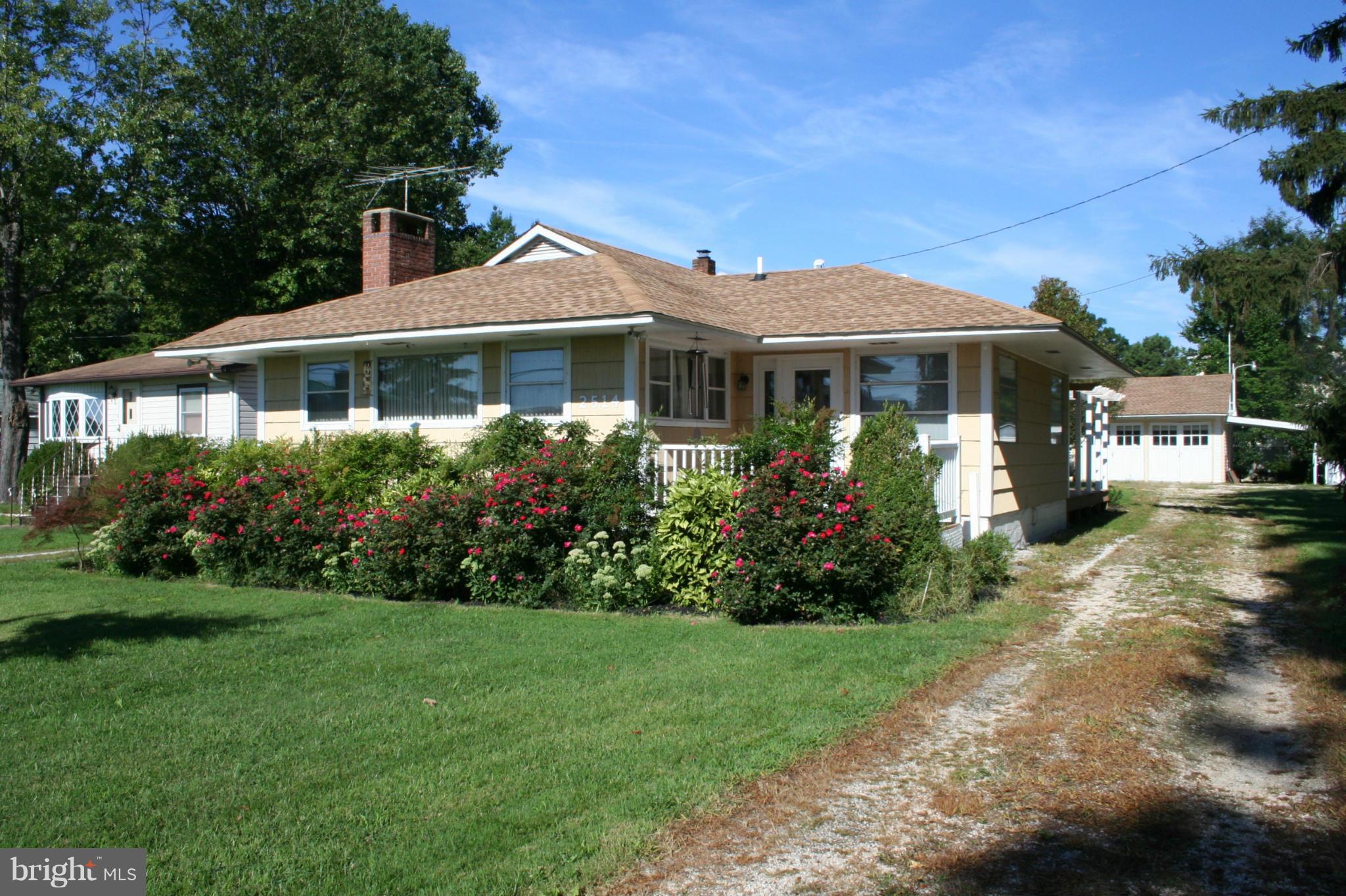 2514 Barrison Point Road Essex, MD 21221 - Photo 1 of 22 a front view of a house with a garden