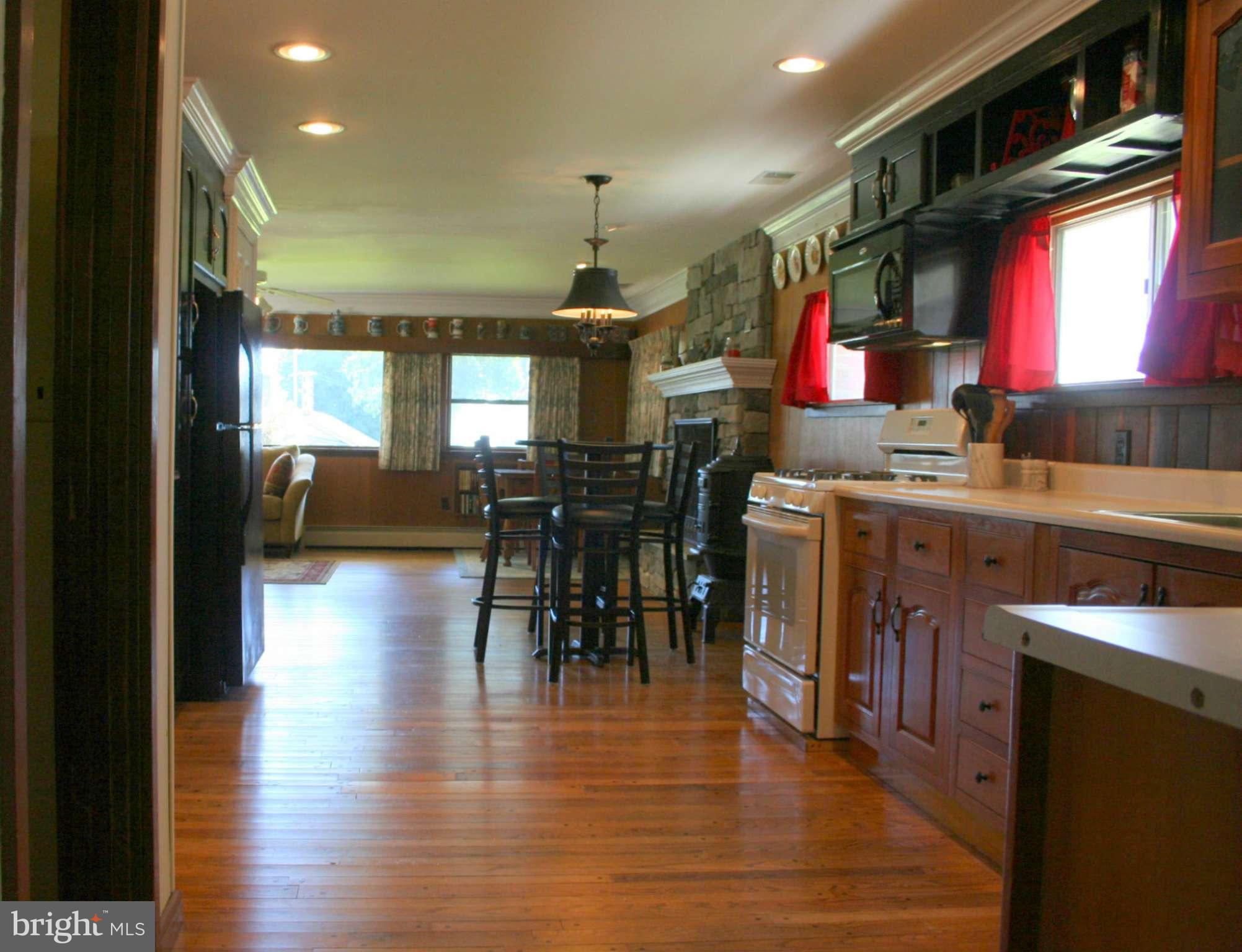 2514 Barrison Point Road Essex, MD 21221 - Photo 11 of 22 a view of a kitchen and dining room