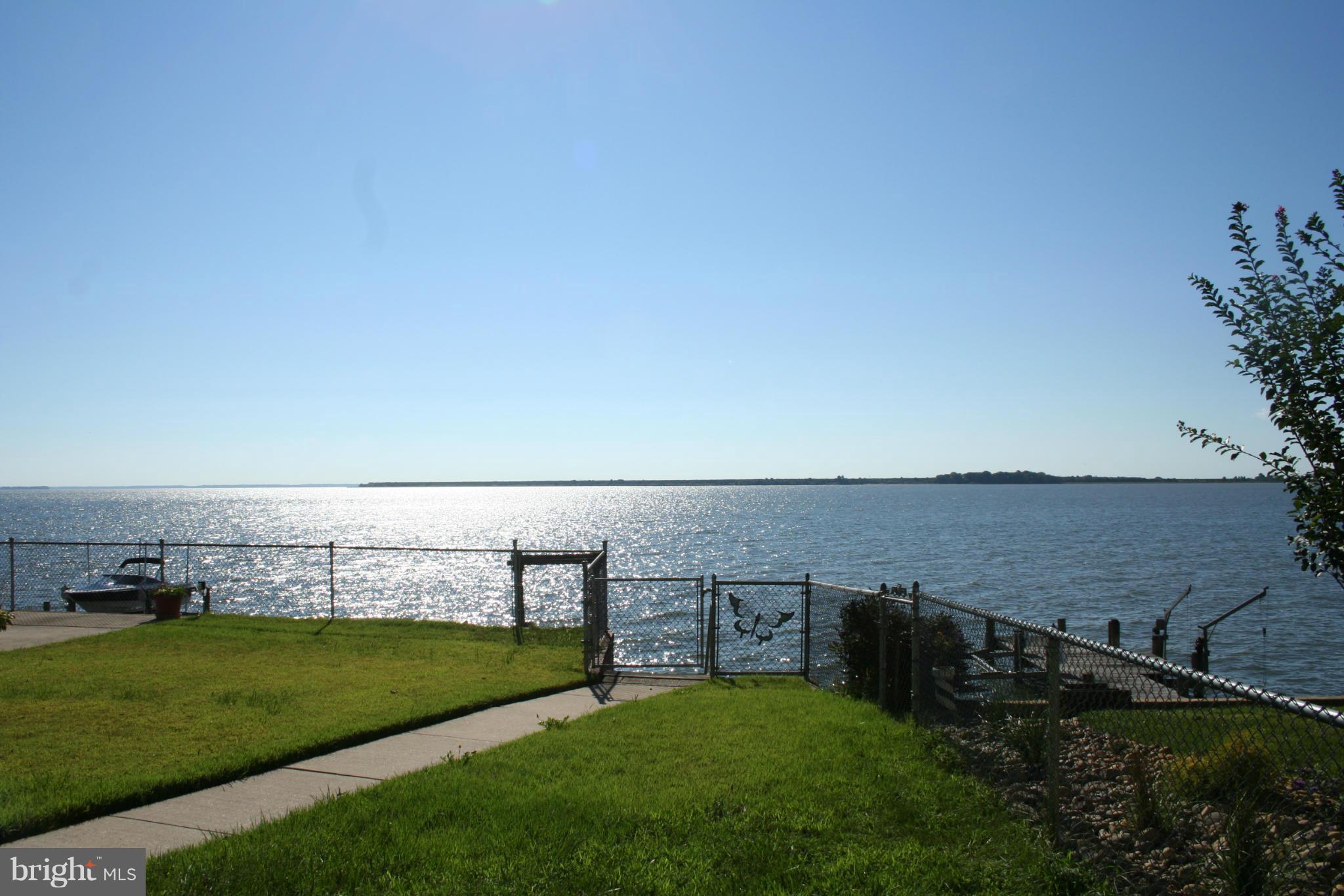 2514 Barrison Point Road Essex, MD 21221 - Photo 3 of 22 a view of a lake with a big yard