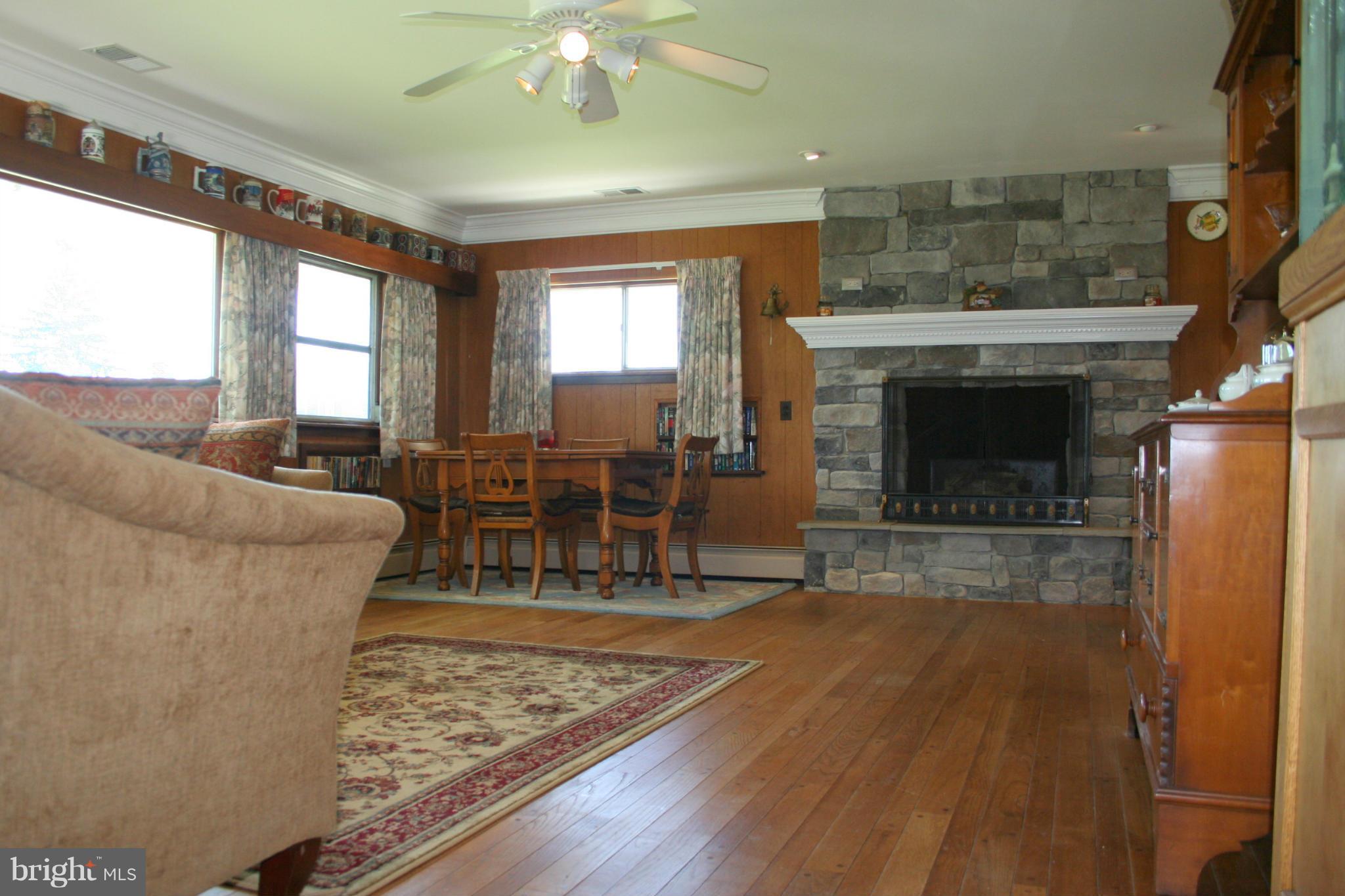 2514 Barrison Point Road Essex, MD 21221 - Photo 5 of 22 a living room with furniture and a fireplace