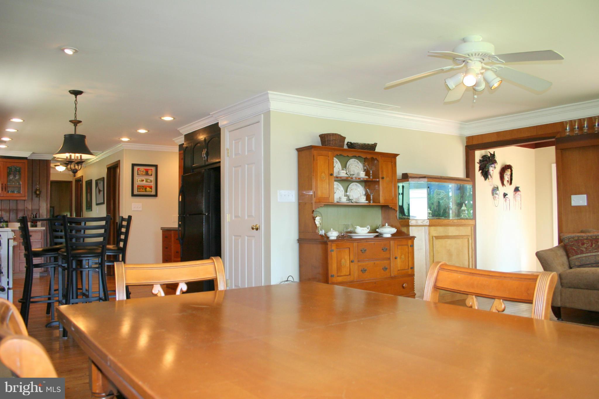 2514 Barrison Point Road Essex, MD 21221 - Photo 10 of 22 a living room with furniture and a chandelier