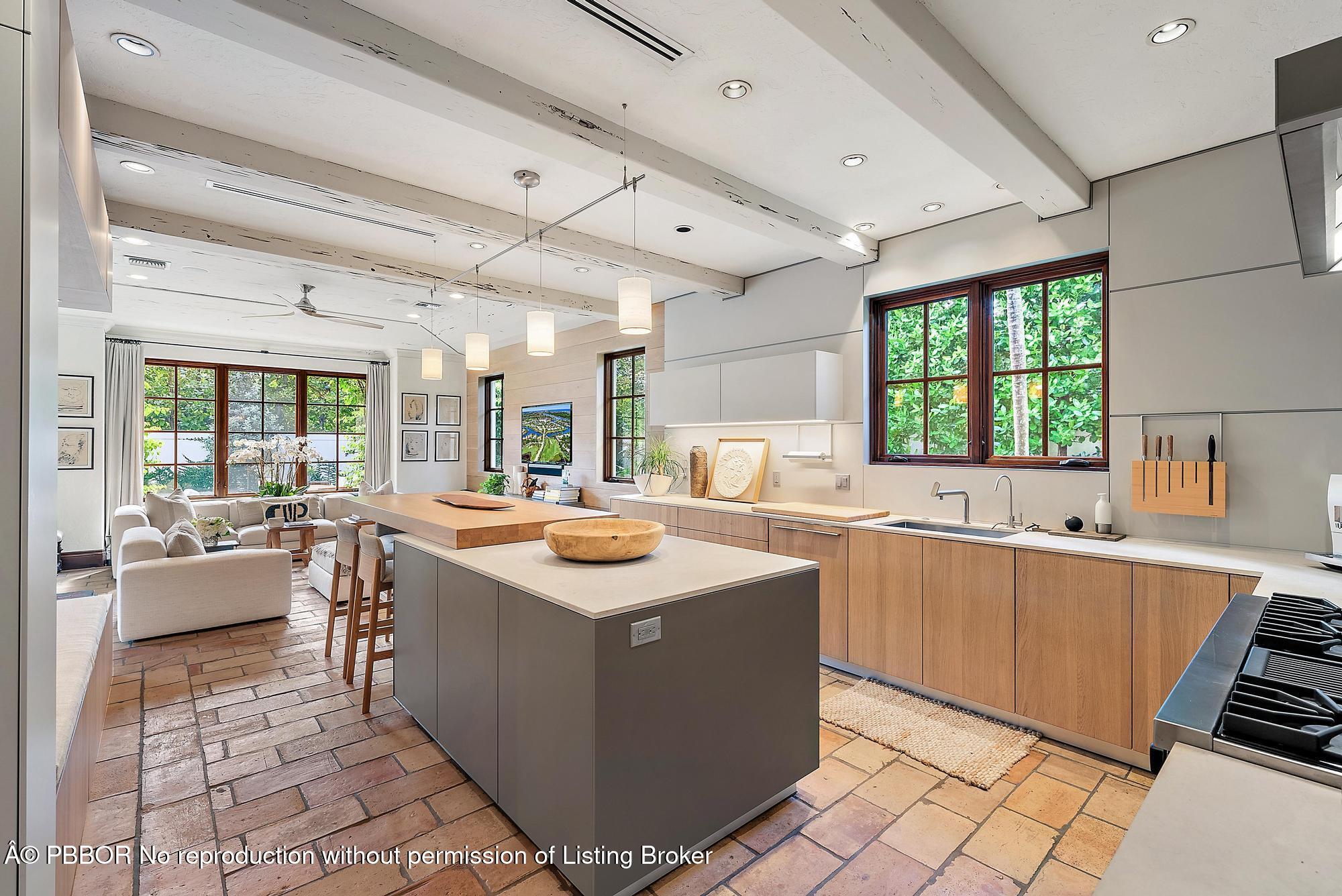 234 Ridgeview Drive Palm Beach, FL 33480 - Photo 10 of 20 a kitchen with stainless steel appliances granite countertop a sink counter space and a stove