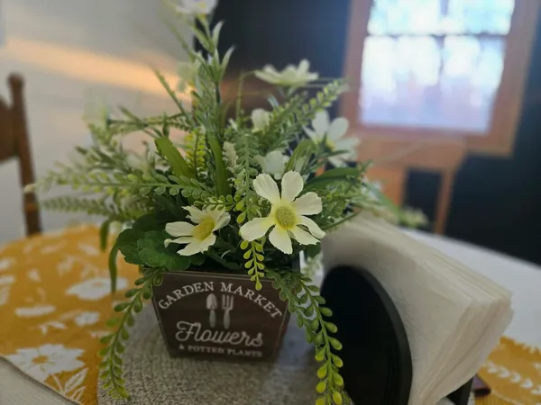 a vase of flowers sitting on a table