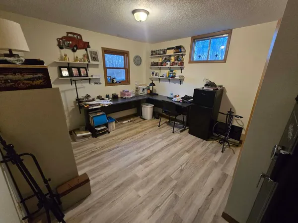 a room with a bed and furniture