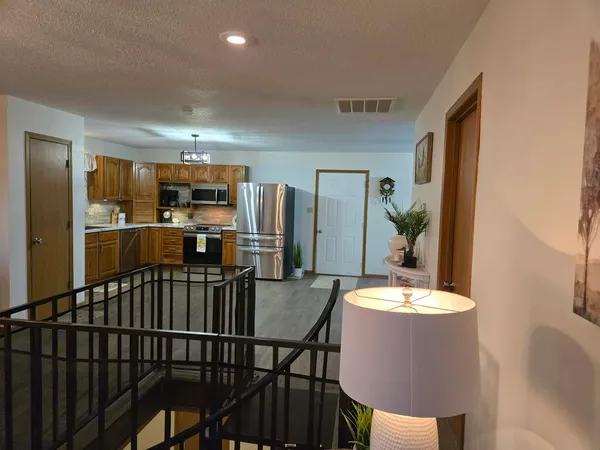 a view of a dining room with furniture and window
