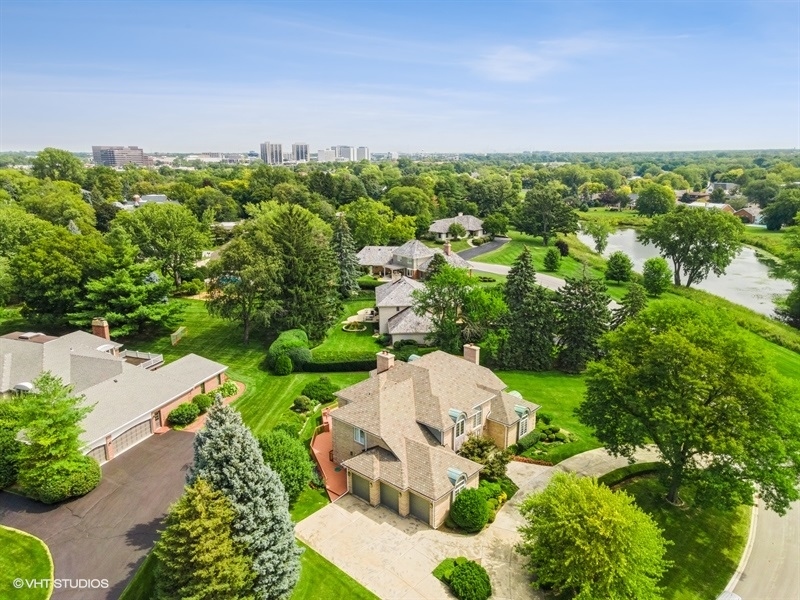 14 Kimberley Circle Oak Brook, IL 60523 - Photo 15 of 17 a view of a garden with a building in the background