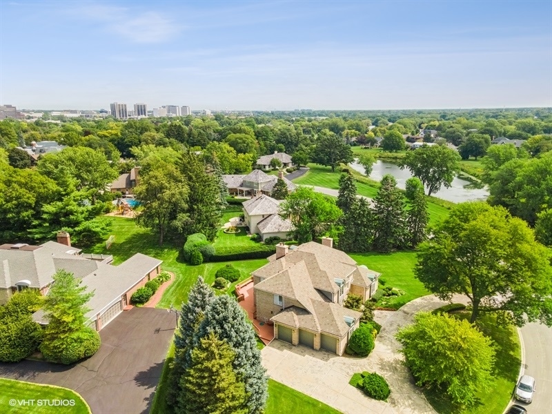 14 Kimberley Circle Oak Brook, IL 60523 - Photo 5 of 17 a view of a garden with a building in the background