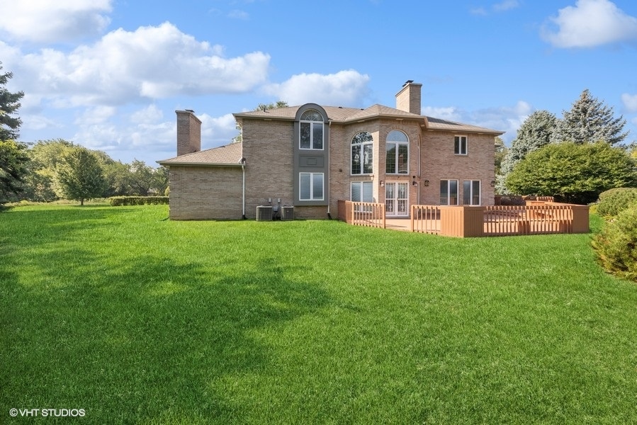 14 Kimberley Circle Oak Brook, IL 60523 - Photo 10 of 17 a front view of a house with a yard and sitting area