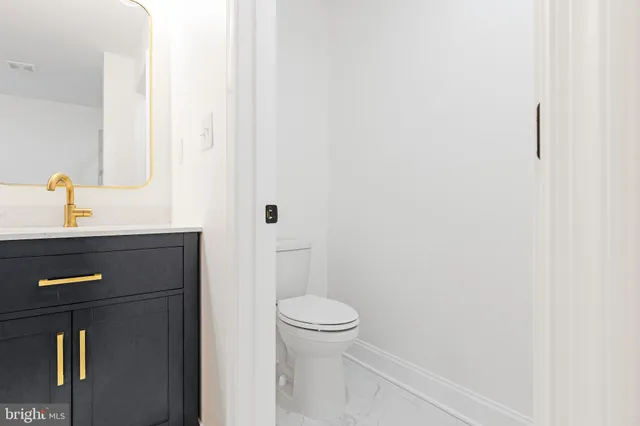 a bathroom with a toilet and a sink