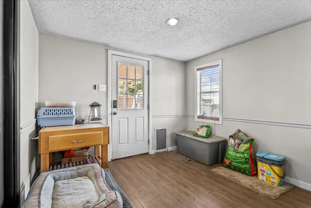 a bedroom with furniture and a window