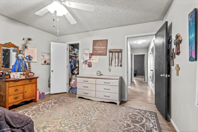 a view of a bedroom with furniture and toys