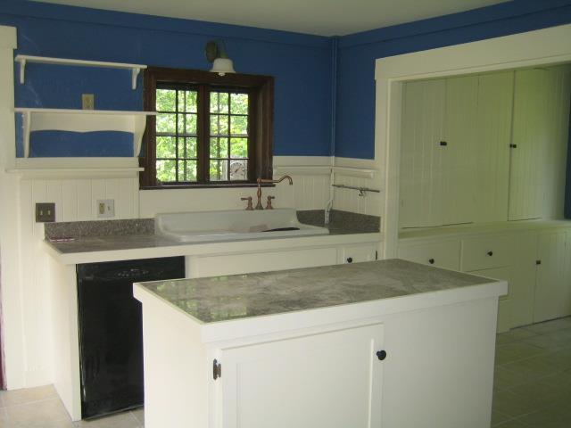 granite counters and tile floor