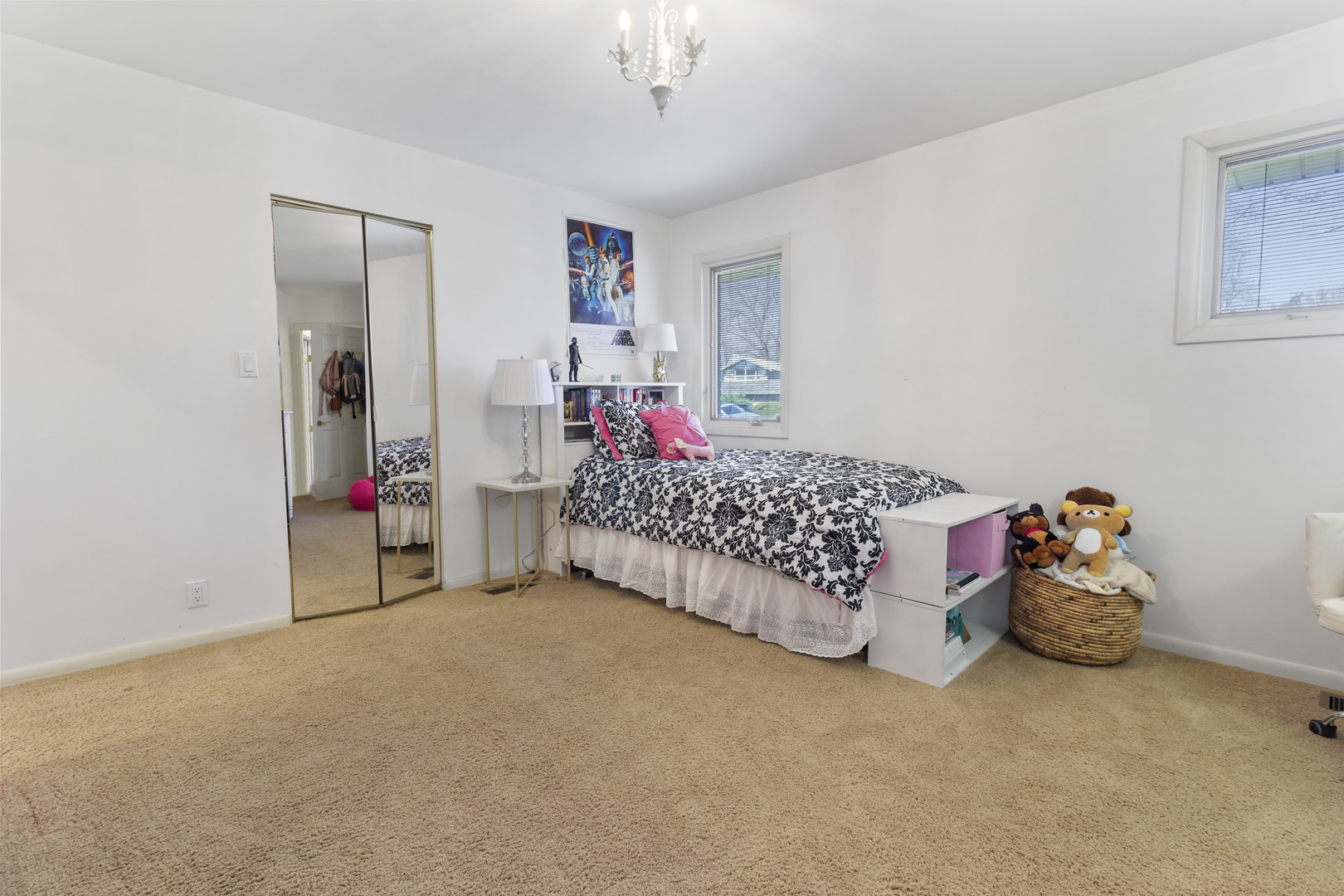45 Greencroft Drive Champaign, IL 61821 - Photo 17 of 26 a bed room with a bed and a chandelier