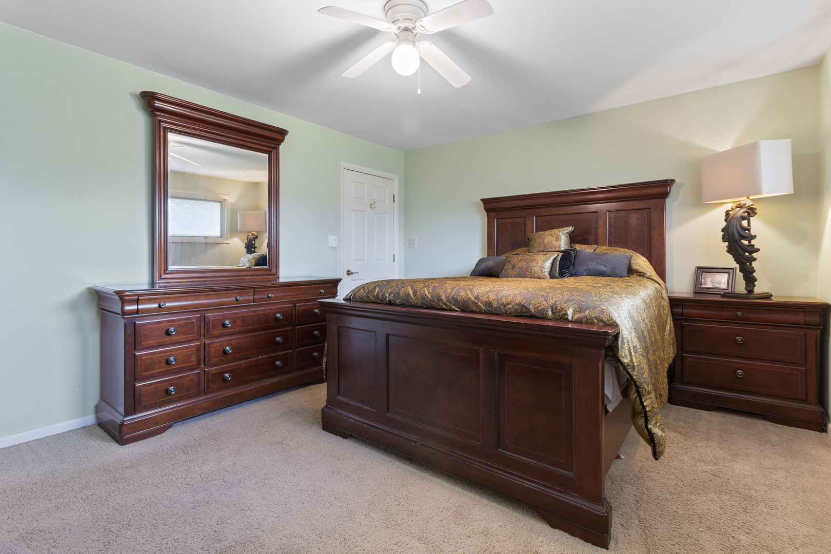 45 Greencroft Drive Champaign, IL 61821 - Photo 20 of 26 a bedroom with a bed and a dresser
