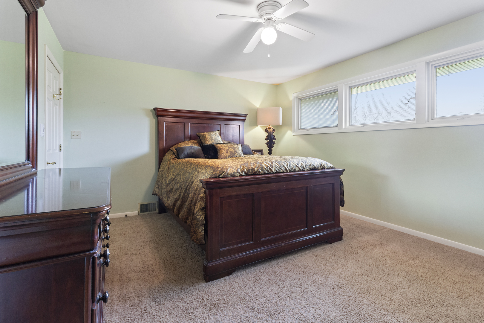 45 Greencroft Drive Champaign, IL 61821 - Photo 21 of 26 a bedroom with a bed and cabinet