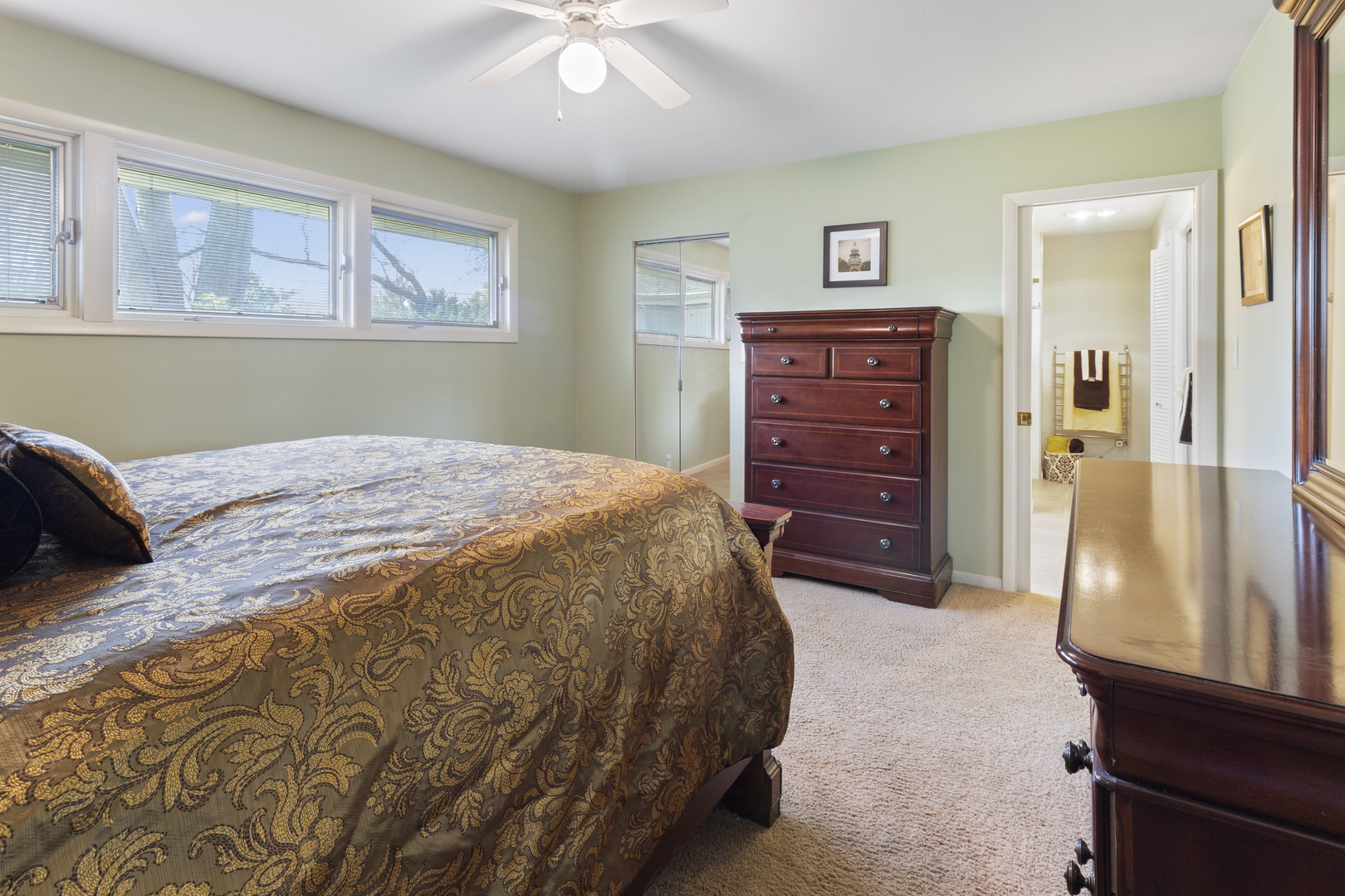 45 Greencroft Drive Champaign, IL 61821 - Photo 22 of 26 a spacious bedroom with a bed and a dresser
