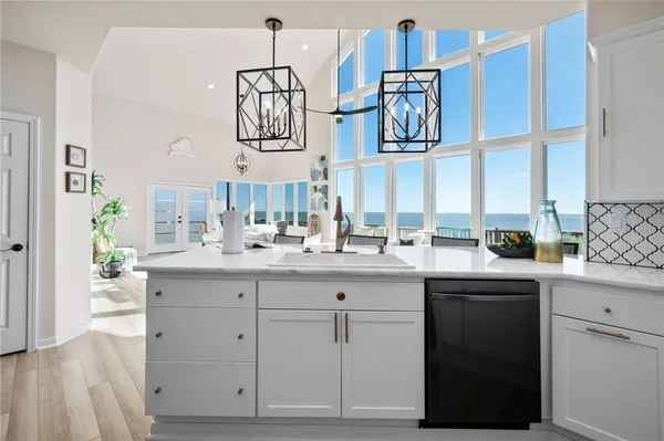 a kitchen with a sink and cabinets