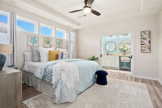 a bedroom with a bed and painting on the wall