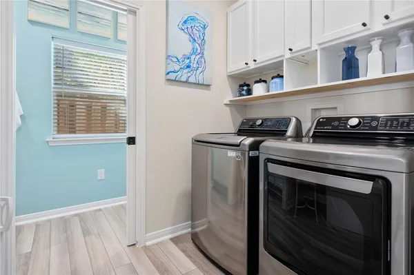 a kitchen with a stove and a window