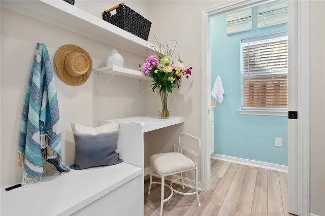 a dining room with furniture and window