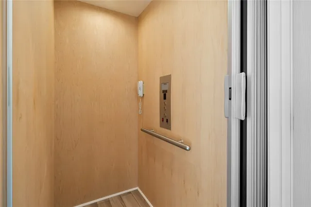 a view of staircase with wooden floor and a potted plant