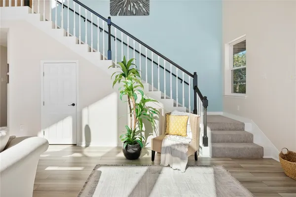 a bedroom with a bed and a wall painting